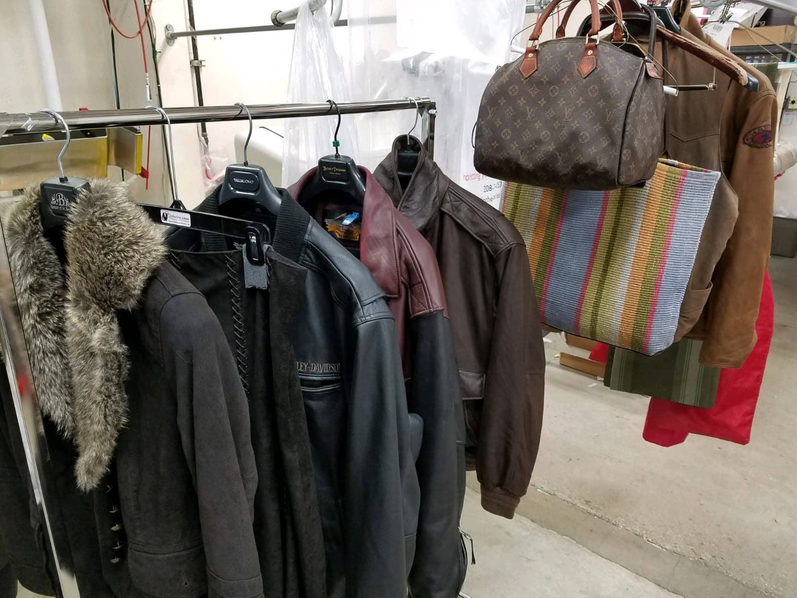 Leather jackets and handbags being cleaned at Clothesline Cleaners