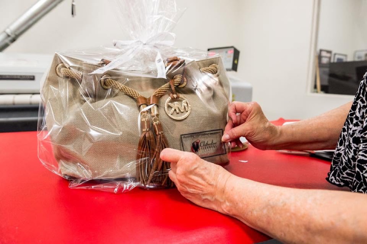 Handbag packaged after professional cleaning at Clothesline Cleaners